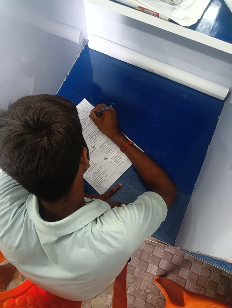 A student writing an exam at an EERA study centre