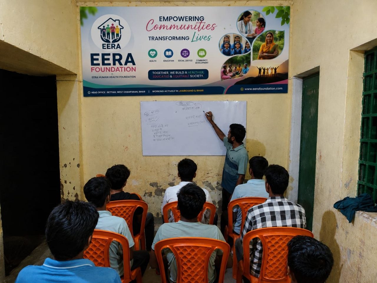 A teacher explaining lessons to students at the EERA centre